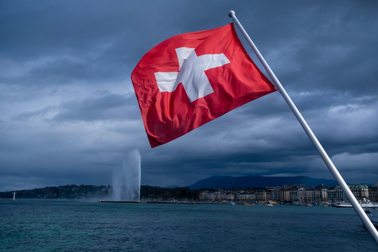 Switzerland is testing a Swiss Franc stablecoin to fix online shopping and ticket scalping A minimalist, high-fashion editorial photograph of a Swiss flag