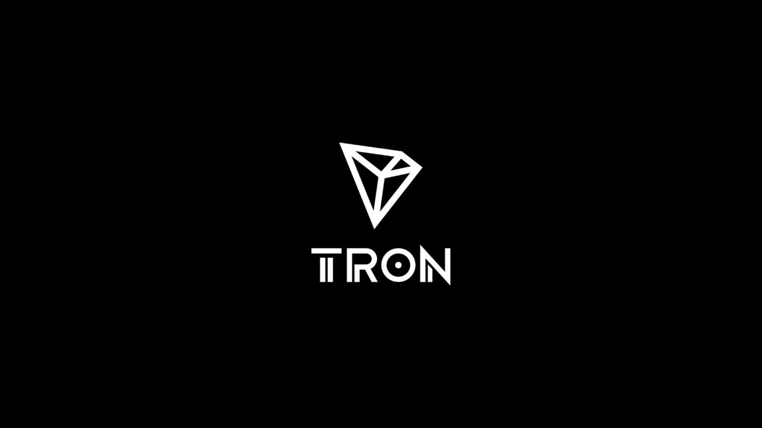 White geometric TRON logo centered on a black background, featuring the stylized triangular emblem above the word “TRON,” with a sleek, modern tone
